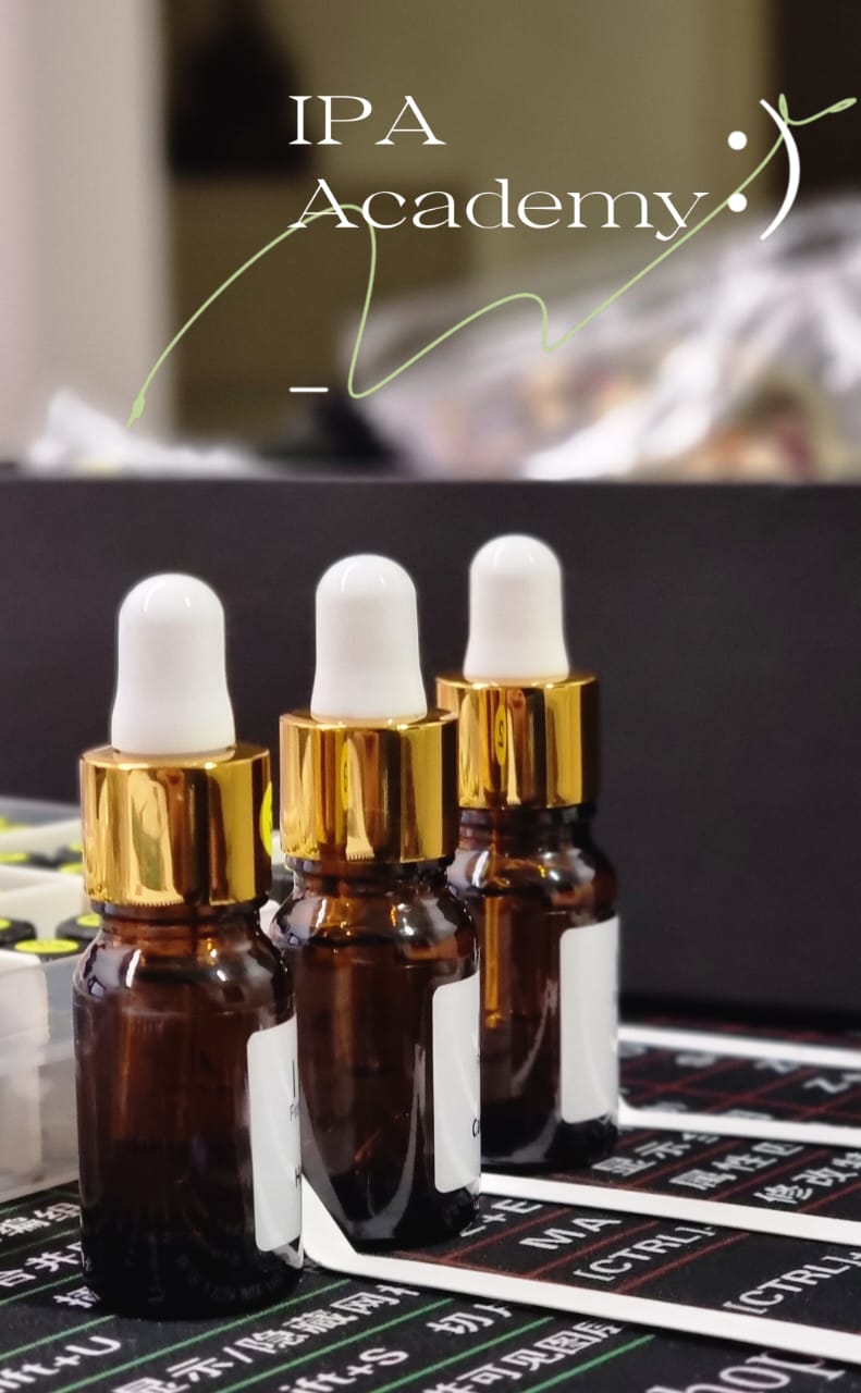 Amber aroma bottles in a warm, natural setting